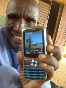 Ahmadou and his new phone.